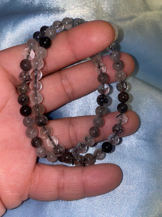 Black tourmaline in quartz bracelets